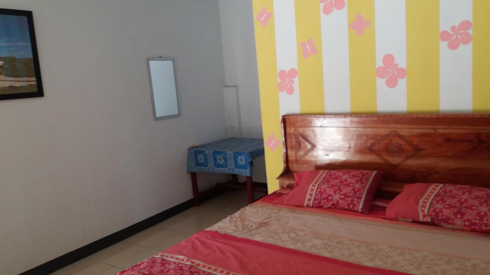 Ekas Beach Guesthouse Mitra Reddoorz Room photo